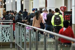 Black Friday shoppers take advantage of steep sale prices at many stores at the Connecticut Post Mall in Milford, Conn. on Friday, November 26, 2021. After the Christmas holiday, Connecticut saw the biggest weekly jump in new unemployment claims since the start of the pandemic.