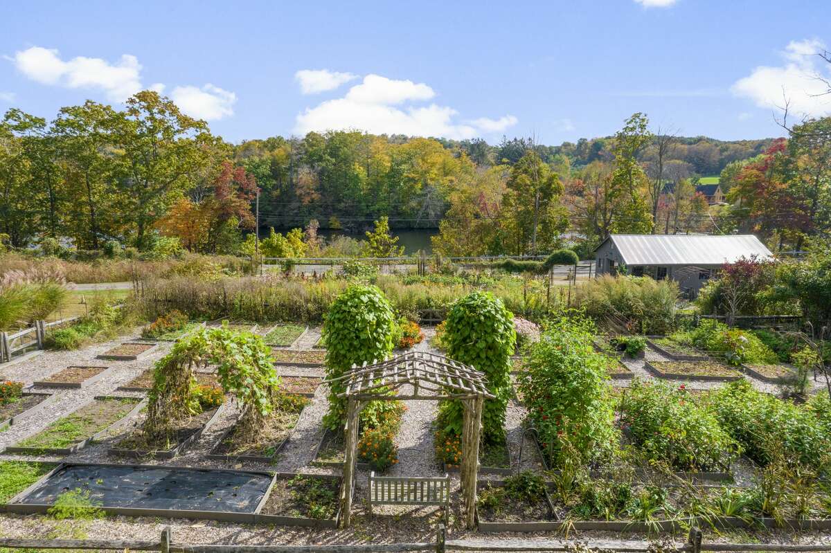 The home on 3700 Durham Road in Guilford, Conn. has a "special permit use," which allows it to be operated as a working flower farm. 