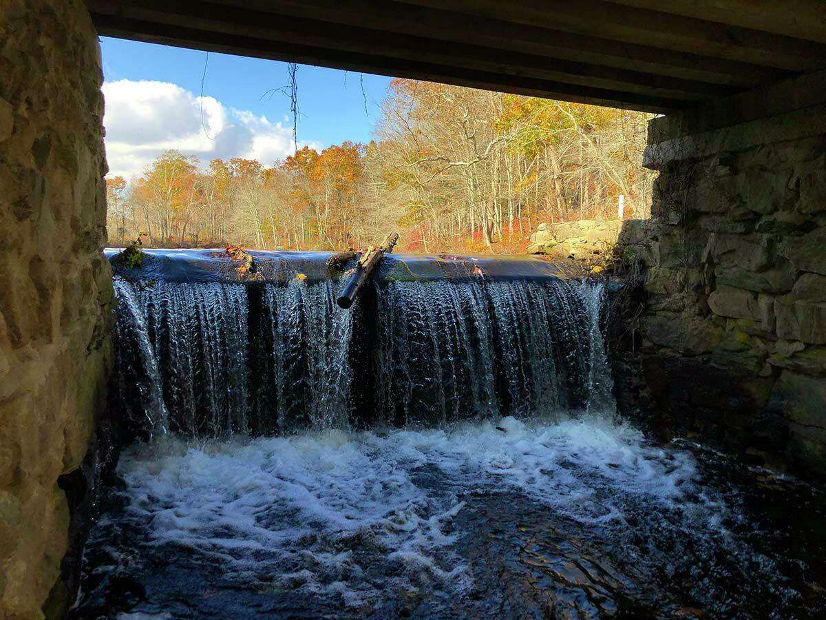 The dam spillway includes a fishing platform.  