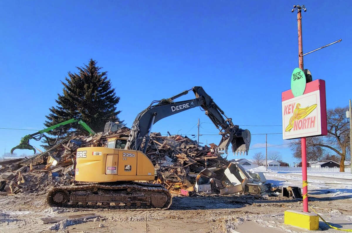 Caseville's Key North Surf Shop, gutted by fire on Dec. 23, is demolished on Friday afternoon. The shop's new location across the street from the original shop will be open for business in plenty of time for the 2022 Cheeseburger in Caseville festival. (Contributed)