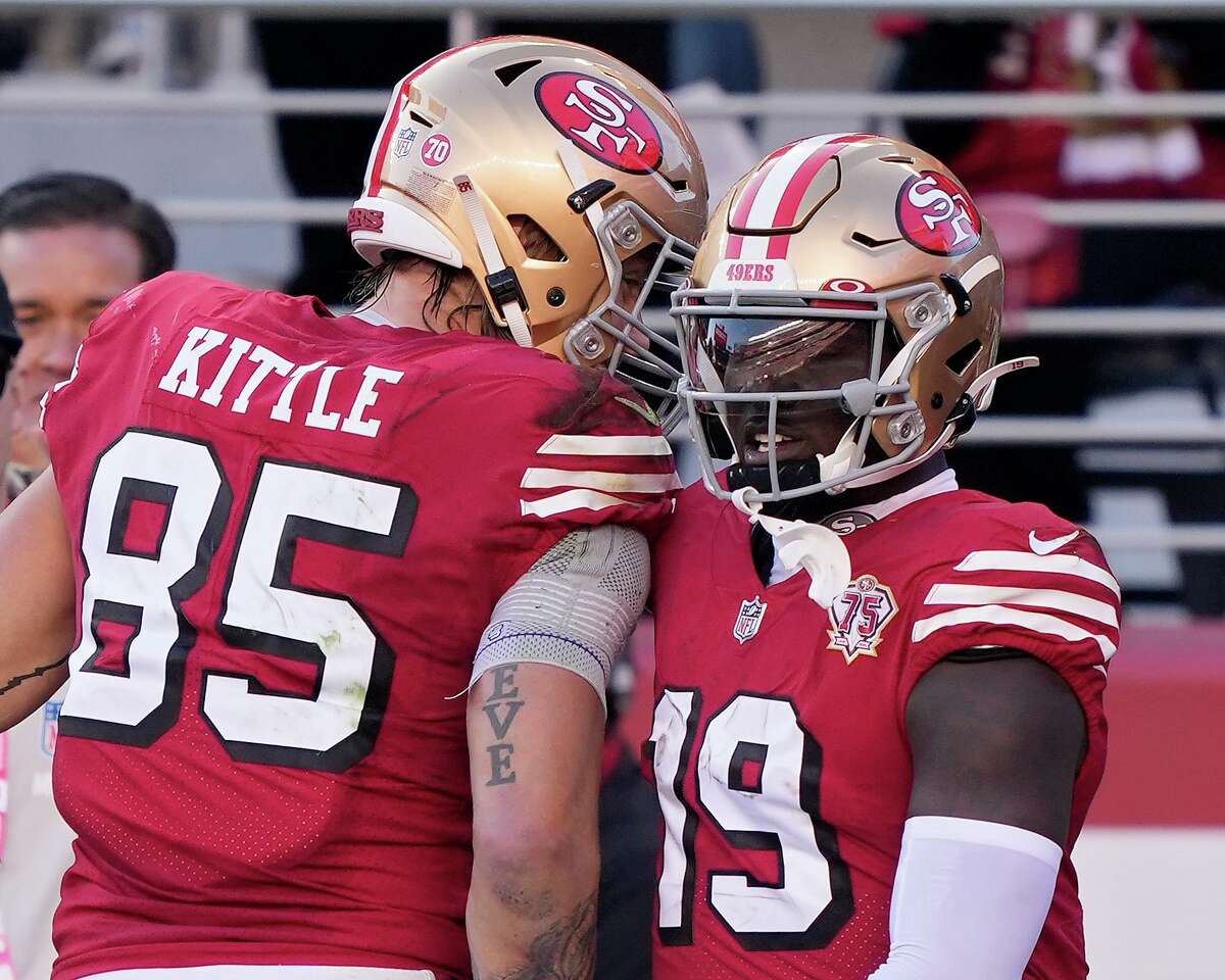 SANTA CLARA, CALIFORNIA - DECEMBER 19: Deebo Samuel #19 of the San Francisco 49ers celebrates with George Kittle #85 after rushing for a ten-yard touchdown against the Atlanta Falcons in the second quarter of the game at Levi's Stadium on December 19, 2021 in Santa Clara, California. (Photo by Thearon W. Henderson/Getty Images)