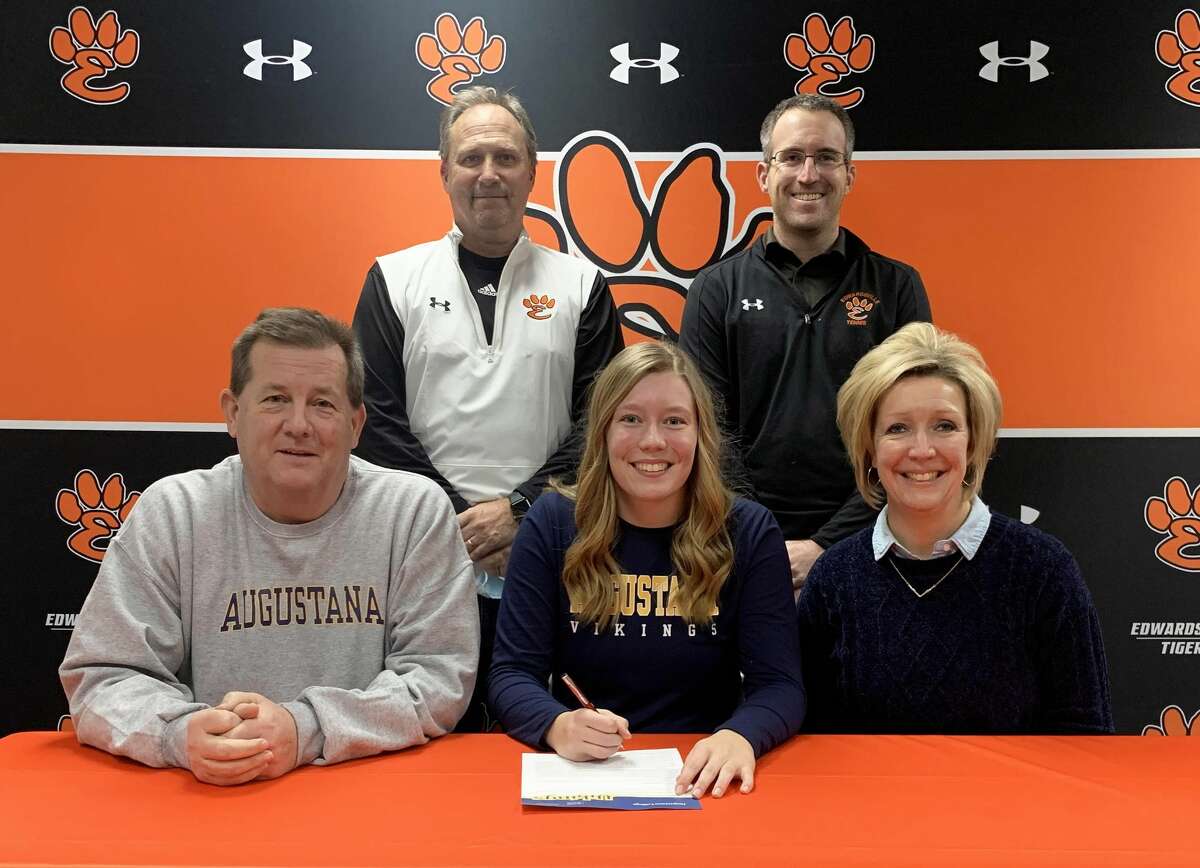 Edwardsville senior Hannah Colbert, seated center, will continue her education and tennis career at Augustana College.