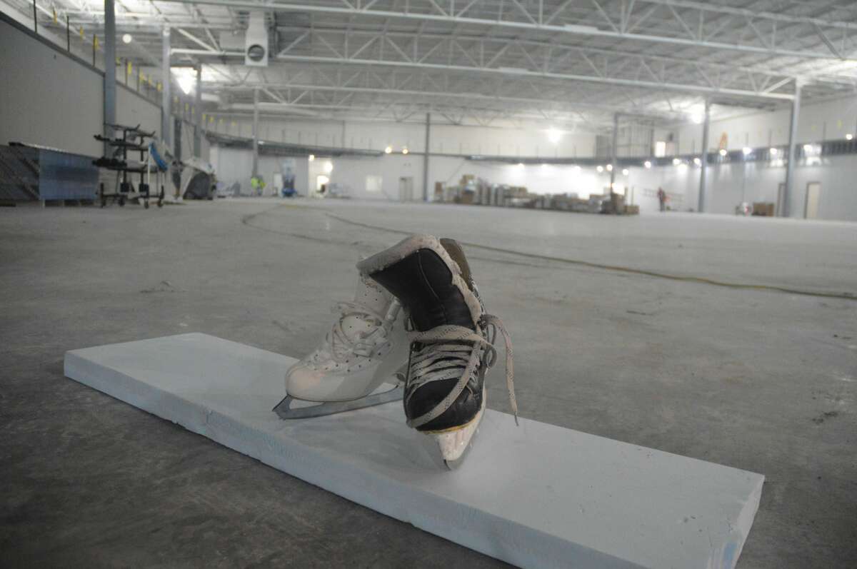 A figure ice skate (left) and a hockey skate (right) at the R.P. Lumber Center, a new ice rink being constructed on Tiger Drive. 