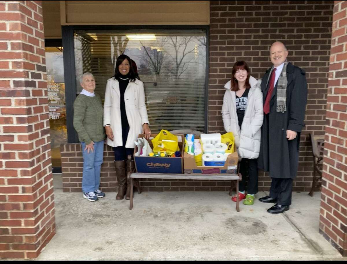 The local volunteer organization, Justice Southbury, recently participated in a holiday drive to support the Southbury Food Bank. Shown in the photo with the donated supplies are: From the left to the right: Mary Zakrzewski of the Southbury Food Bank, and Colette Mombo, Julia Bower Richardson, and Rick Richardson of Justice Southbury.