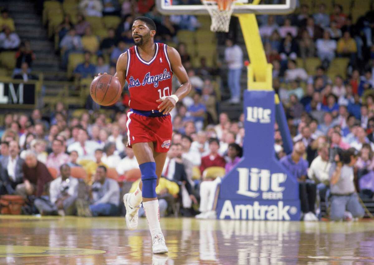Norm Nixon #10 of the Los Angeles Clippers dribbles the ball during the NBA game against the Los Angeles Lakers at the Great Western Forum, in Los Angeles, California on January 1, 1989.