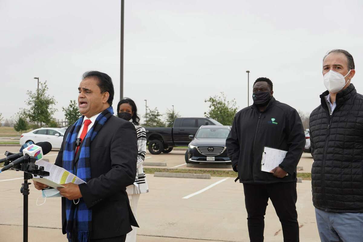 Fort Bend County Judge KP George, left, speaks during a news conference on Friday, Jan. 7, announcing the county’s new mega COVID-19 testing site at Brazos River Park in Sugar Land. The drive-thru site has the capacity to test 1,500 people each day.