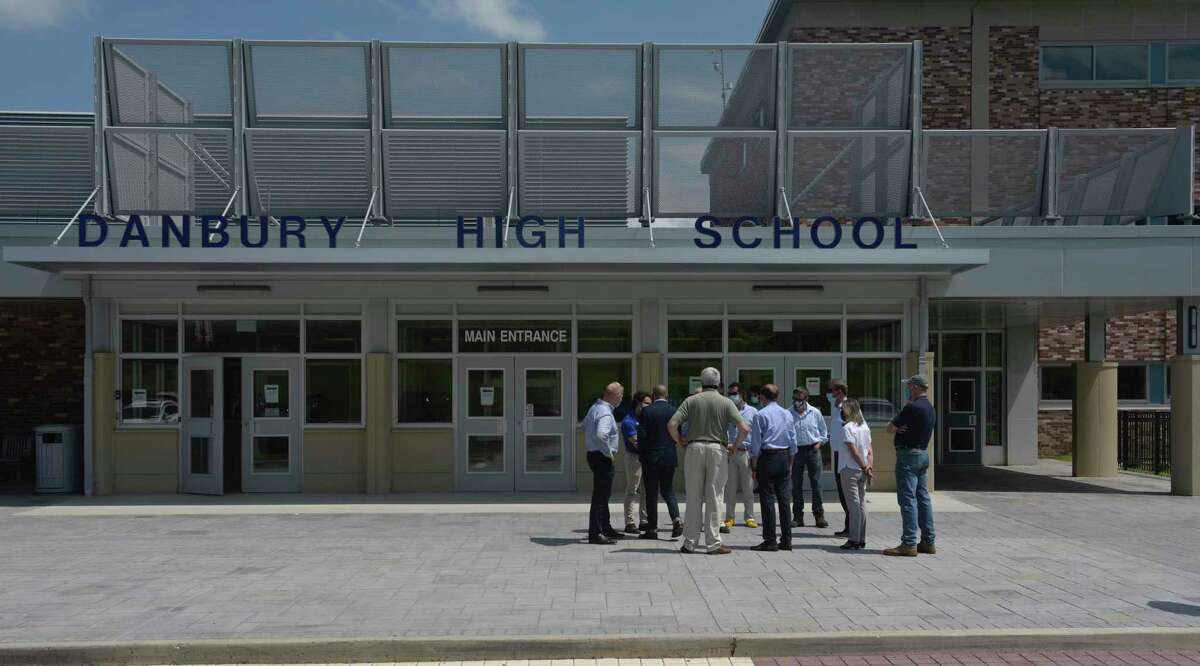 Governor Ned Lamont talks to local officials before a press conference held at Danbury High School. Friday, August 7, 2020, in Danbury, Conn.