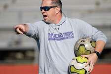 Coach Chad Luttrull shows his team what he expects as the Port Neches-Groves Indians boys soccer team practices at the school on Thursday, February 27, 2020. Fran Ruchalski/The Enterprise