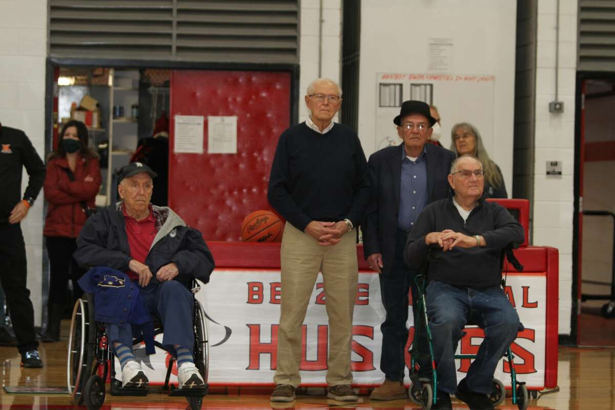 From left to right: Fred Scarbrough, a member of the 1951 Cyclones, Ben Blaho, Chuck Bigelow, and Larry McGinity prepare to be honored by Benzie Central on Jan. 7. 