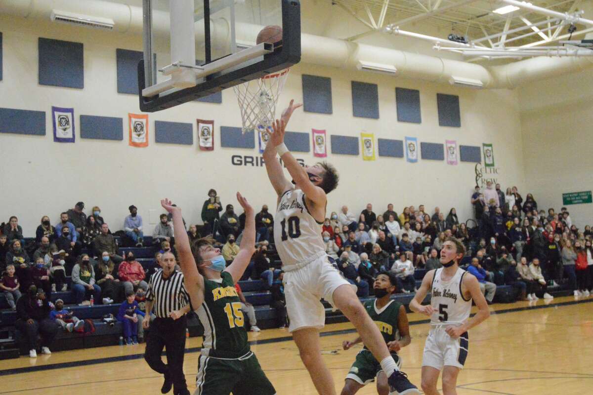 Jackson Rodgers (10) finishes a layup in traffic against Metro-East Lutheran on Friday night. Rodgers scored a game-high 24 points in the 62-51 loss. 