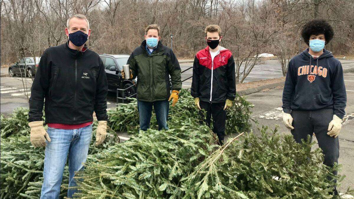 Planet New Canaan is doing its second annual Christmas Tree recycling program through Sunday, Jan. 9, from what began New Year's Day, Saturday, Jan. 1. Pictured from the left to the right are: Douglas Gillespie, Thaddeus Strobach Sr., Thaddeus Strobach Jr., and Walter Schmitz.