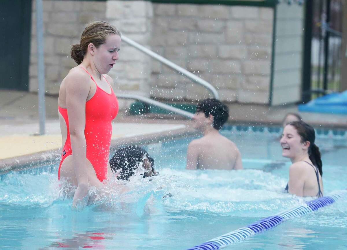 Charlotte Martin take part in the annual Polar Bear Plunge at Mary Pat Case Pool, Saturday, Jan. 8, 2022, in Shenandoah.
