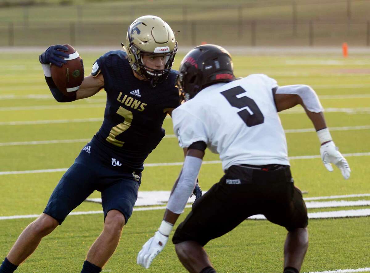 Lake Creek wide receiver Sam Lee (2) looks to pass Porter defensive back Collin Wright (5) during the first quarter of a non-district football game at MISD Stadium on Thursday, Sept. 2, 2021, in Montgomery.
