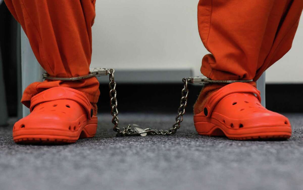 Troy Jones’ feet are shackled as he talks about the experience of voting in-person at the jail Tuesday, Nov. 2, 2021, at the Harris County Jail at 701 Baker St. in Houston.