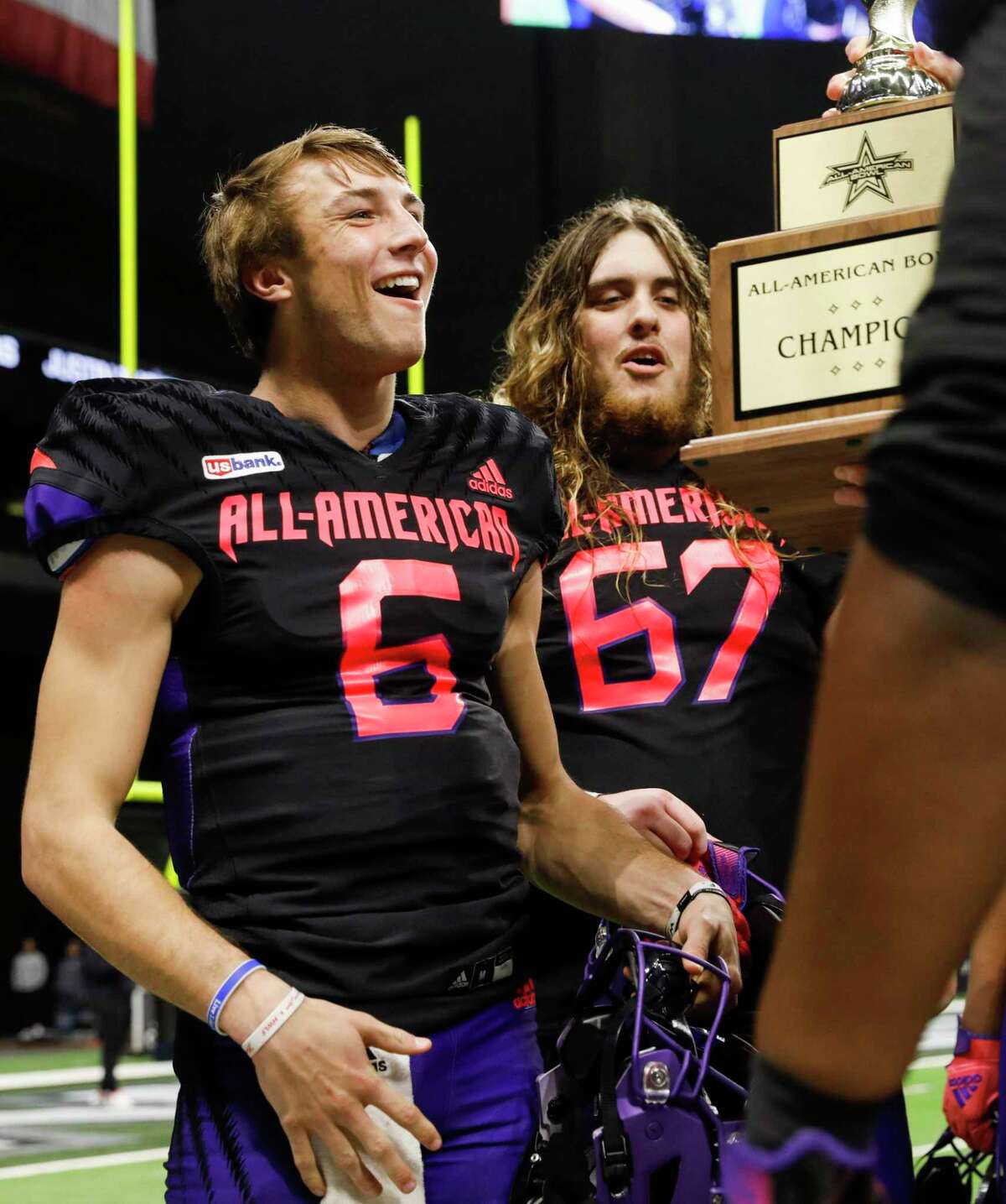 West team’s quarterback Cade Klubnik (6) of Westlake High School in Austin and Hunter Erb (67) of Eaton High School Haslet, Texas, react to being awarded the 2022 All-American Bowl trophy at the Alamodome in San Antonio, Texas, Saturday, Jan. 8, 2022. West defeated East 34-14.