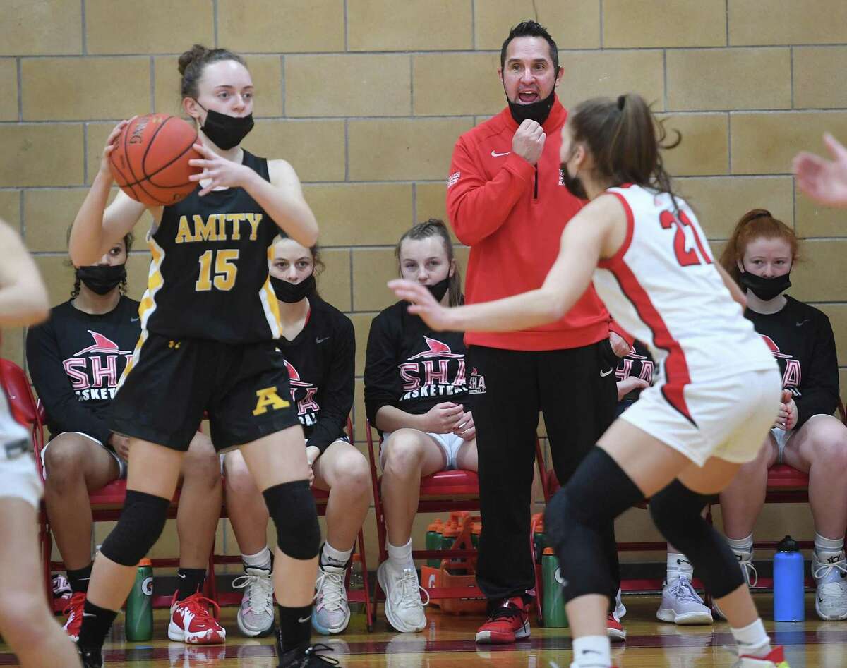 After serving a one-game suspension, coach Jason Kirck returned to the bench, leading his Sacred Heart Academy team to a 54-36 win against Amity on Saturday.