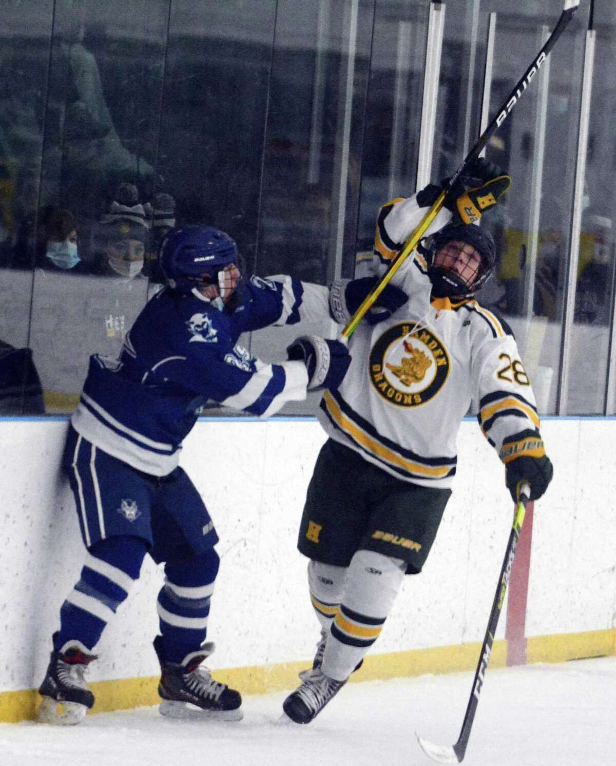 Anthony Malonis of Hamden knocks the puck out of the air during the Green Dragons' 6-3 win Saturday afternoon. Malonis finished with a hat trick in Hamden’s win.