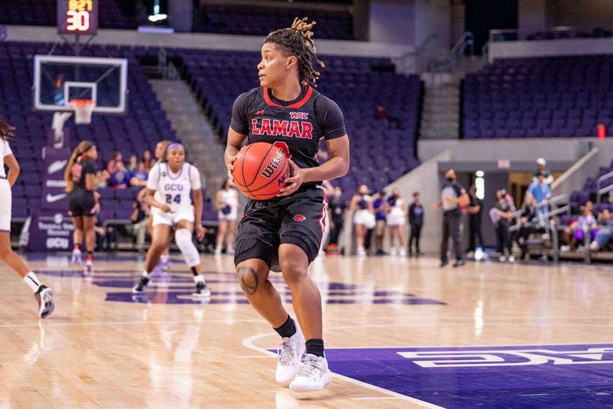 Lamar guard Kayla Mitchell grabs the ball during the Cardinals overtime loss at Grand Canyon University on Saturday in Phoenix.