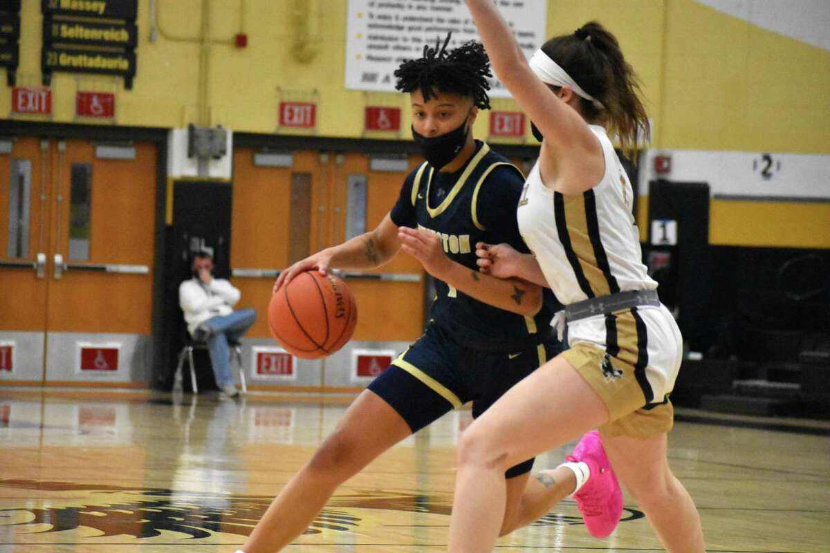 Newington's Lily Ferguson drives to the basket during a girls basketball game between Trumbull and Newington at Trumbull High, Trumbull on Saturday, Jan. 8, 2022.