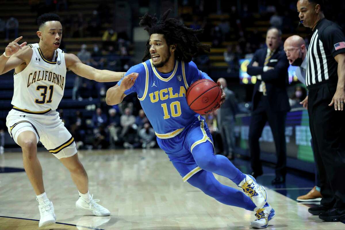 UCLA guard Tyger Campbell (10) drives to the basket against California guard Jordan Shepherd (31) during the first half of an NCAA college basketball game in Berkeley, Calif., Saturday, Jan. 8, 2022. (AP Photo/Jed Jacobsohn)