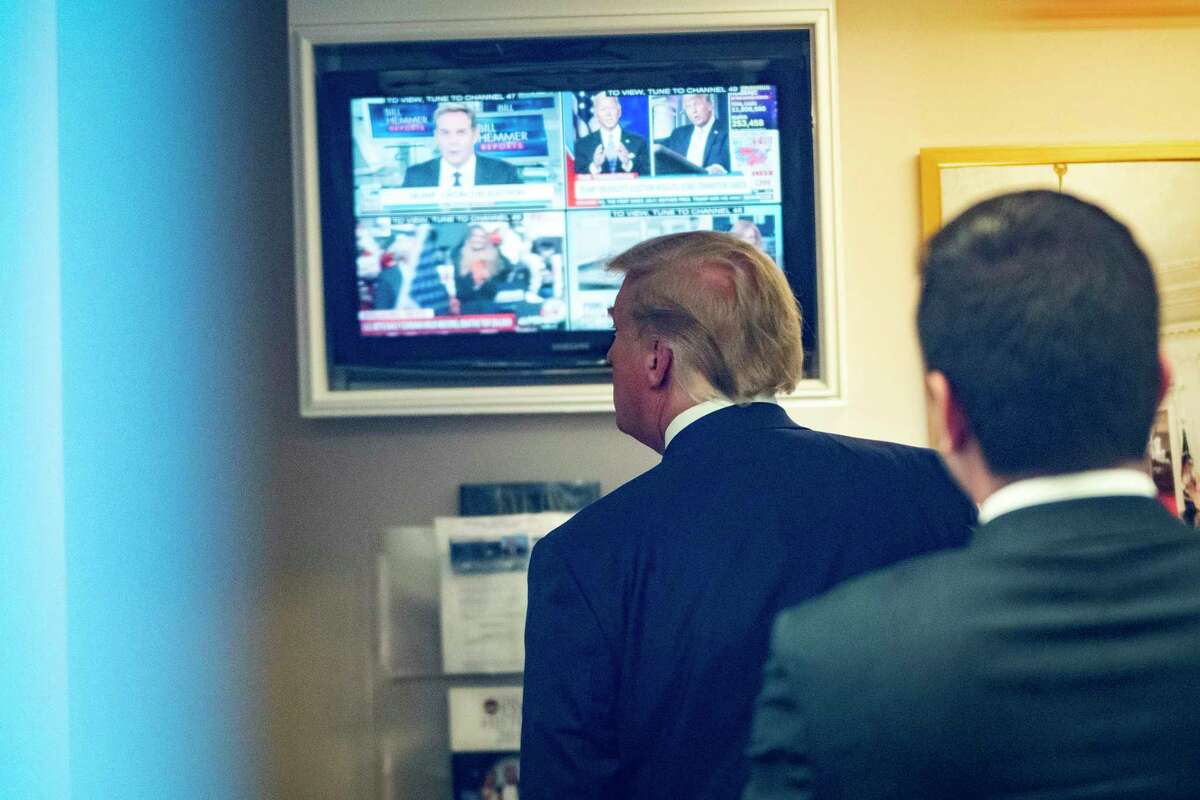 President Donald Trump watches a television in the lower press office after delivering remarks in the James S. Brady Press Briefing Room at the White House, on Nov. 20, 2020.