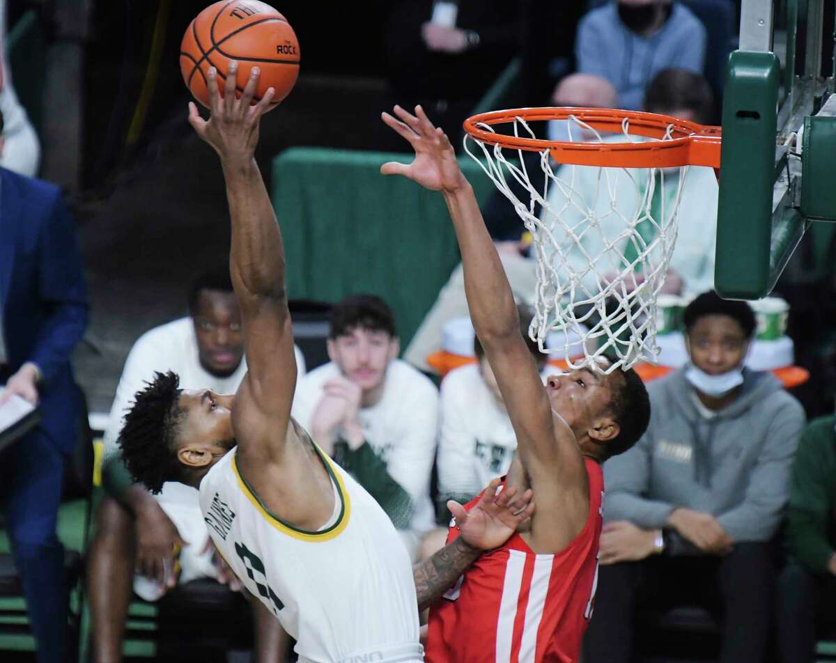 Anthony Gaines of Sinea, left, puts up a shot as Allan Jeanne-Rose of Fairfield tries to stop the shot during their game on Sunday, Jan. 9, 2022, in Albany, N.Y.