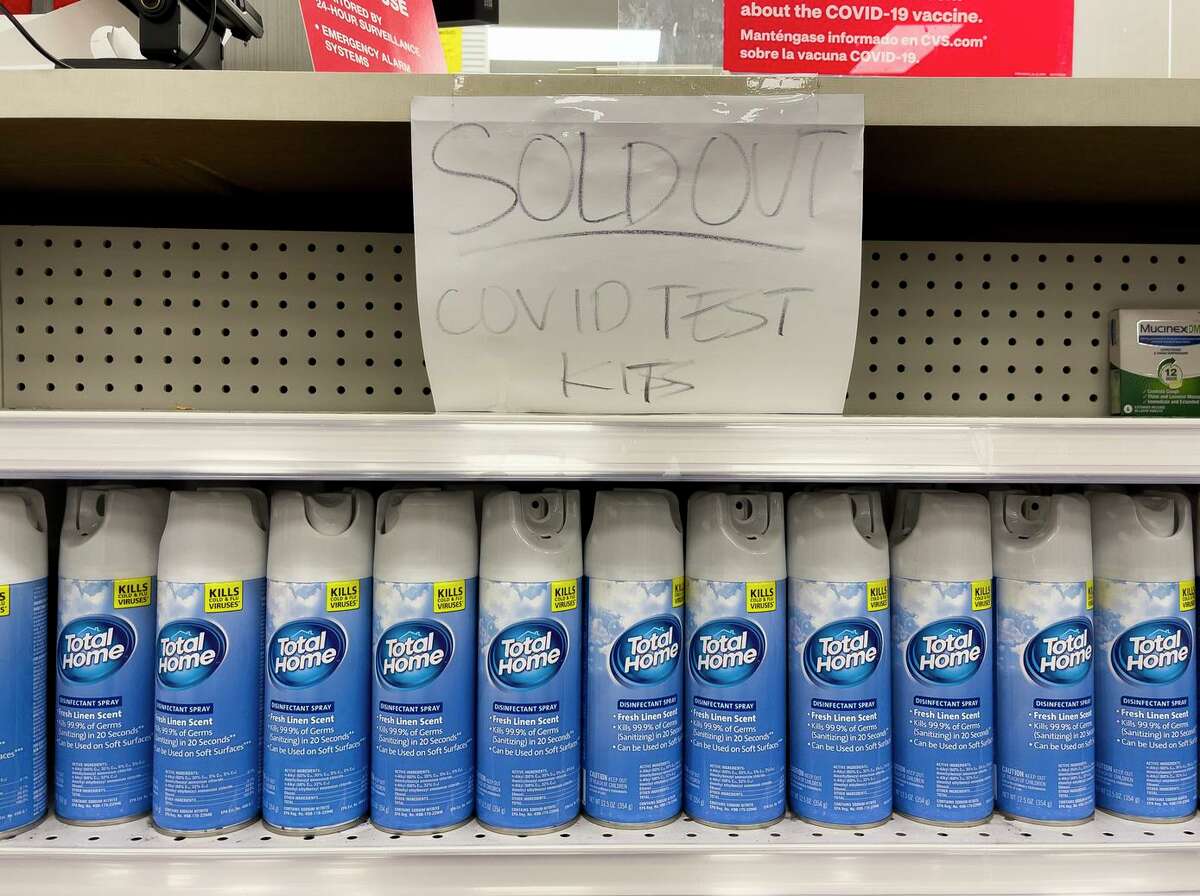 A handwritten notice is posted on an empty shelf after at-home coronavirus test kits were sold out at a CVS store in La Habra (Orange County).