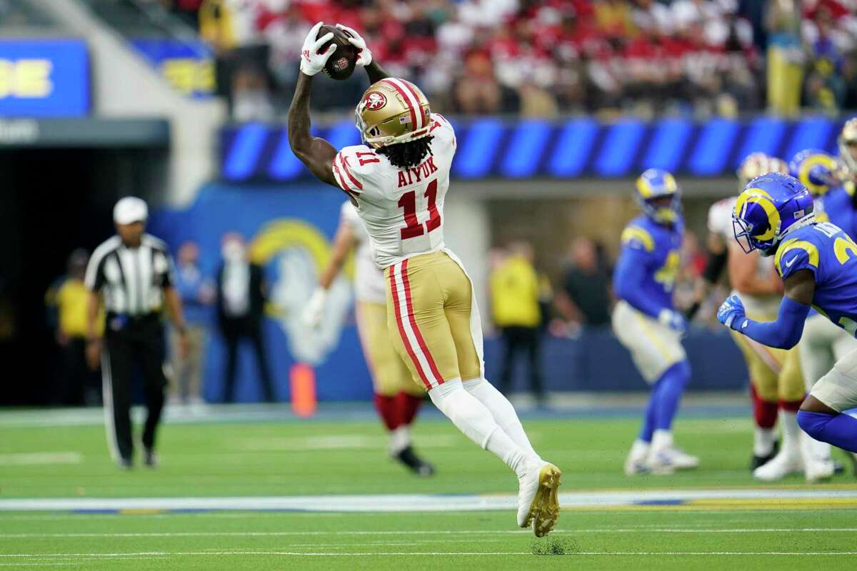 San Francisco 49ers wide receiver Brandon Aiyuk (11) catches a pass during the first half of an NFL football game against the Los Angeles Rams Sunday, Jan. 9, 2022, in Inglewood, Calif. (AP Photo/Marcio Jose Sanchez)