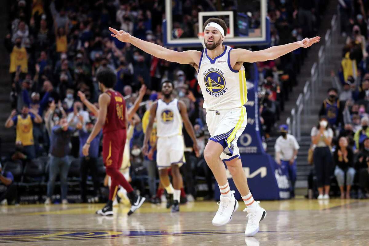 Golden State Warriors' Klay Thompson celebrates a 3-pointer in 3rd quarter against Cleveland Cavaliers during NBA game at Chase Center in San Francisco, Calif., on Sunday, January 9, 2022.