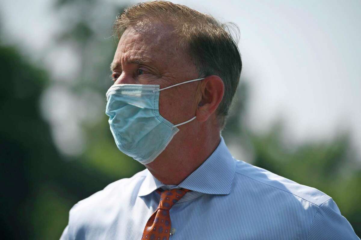 Connecticut Gov. Ned Lamont wearing a mask at Hartford Communities That Care in 2021.