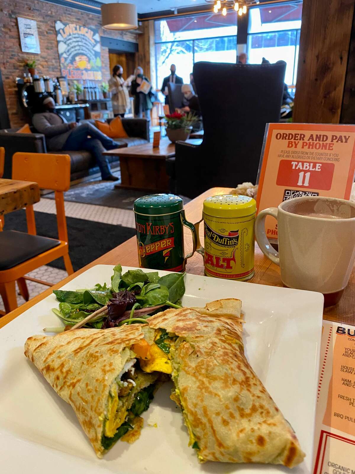 The Breakfast Monster crepe features cage-free eggs, wilted spinach, caramelized onions, roasted squash tossed with pesto and Cabot cheddar.