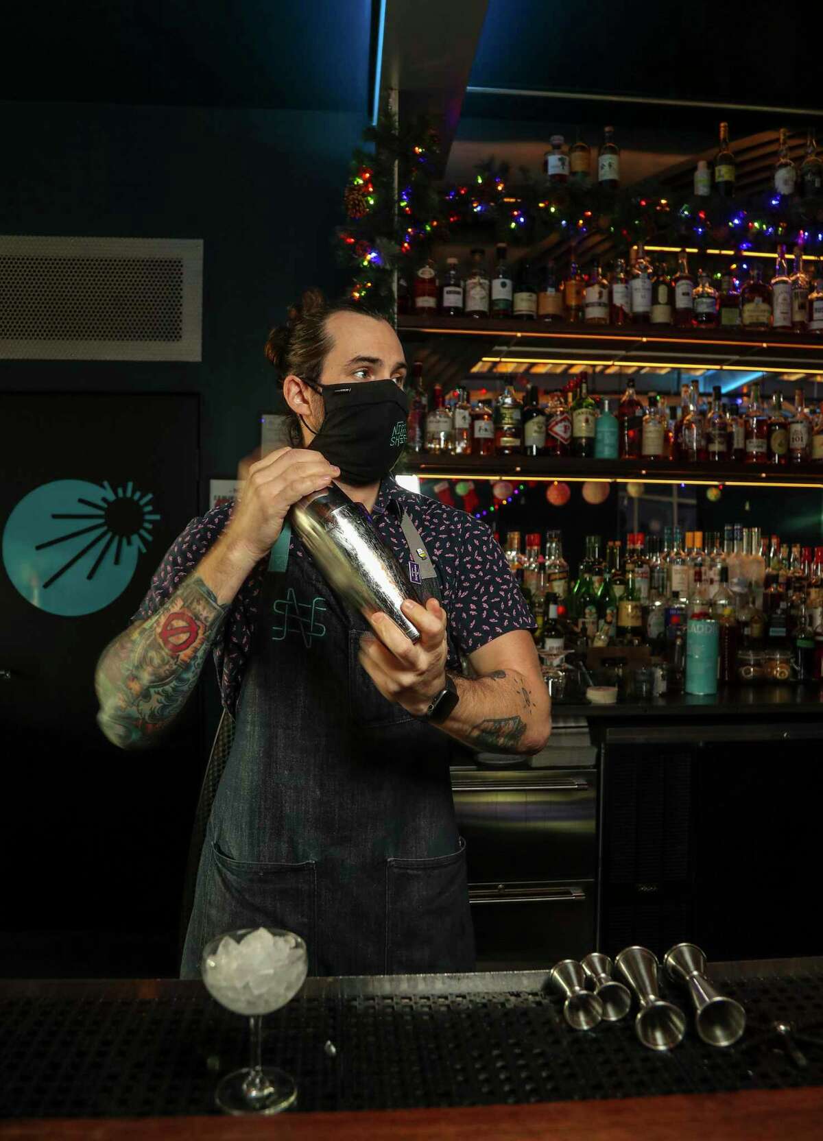 Justin Ware, operating partner of Night Shift at 3501 Harrisburg makes a “Clothed and Normal”, a non-alcoholic cocktail, made with Giffard apertitif Sirop, seedlip citrus, lemon, orange jam, spices and sparkling water at Night Shift, Thursday, Dec. 30, 2021 in Houston. Is Houston's bar scene sober-friendly? It's hit and miss out there if you're not drinking alcohol, but Night Shift in the East End is a bar that's leading the charge with a robust booze-free cocktail program.