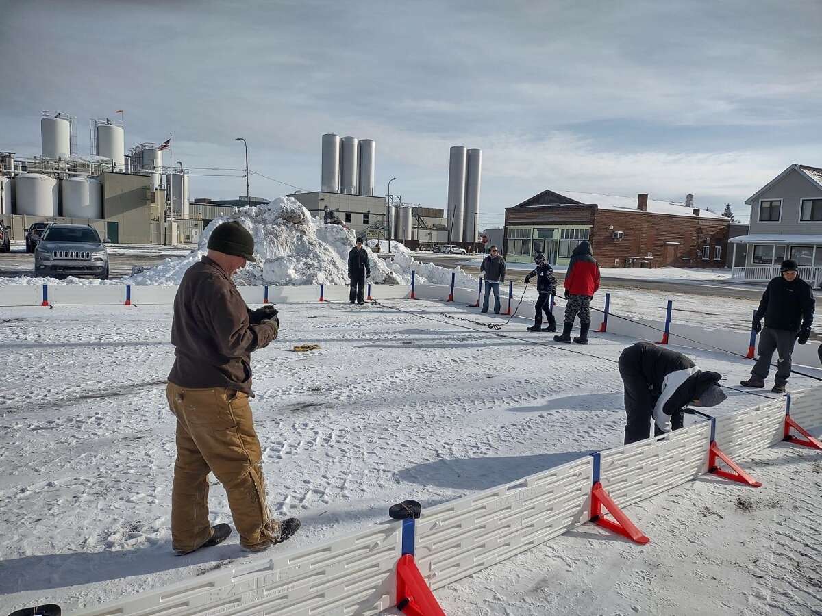 Around 24 volunteers came out to assist in the construction of the new Reed City ice rink on Chestnut Avenue next to Pompeii's Pizza this past weekend. Skaters will have to wait for the water to freeze before venturing out on the ice.