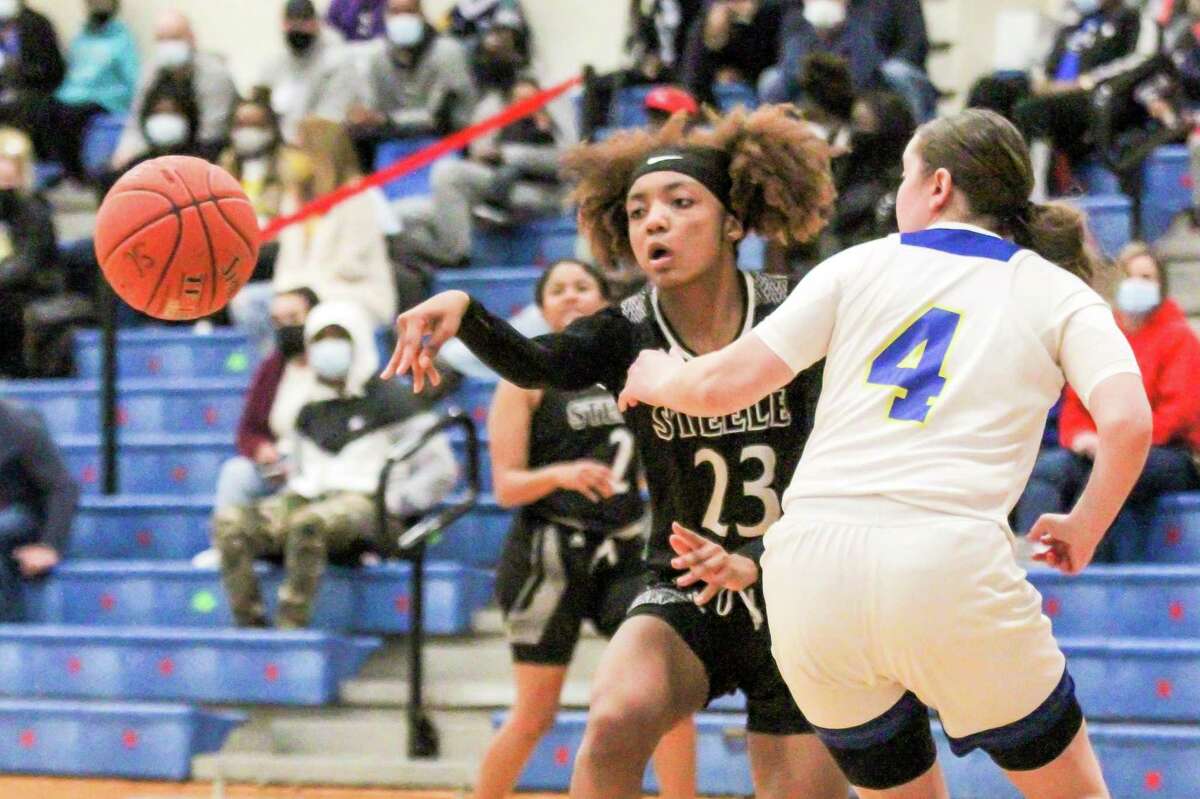 Senior guard Sidney Love, making a pass during a game against Clemens last season, combined for 59 points, 27 boards, 14 assists and 11 steals in Steele’s district victories over Wagner and New Braunfels last week.