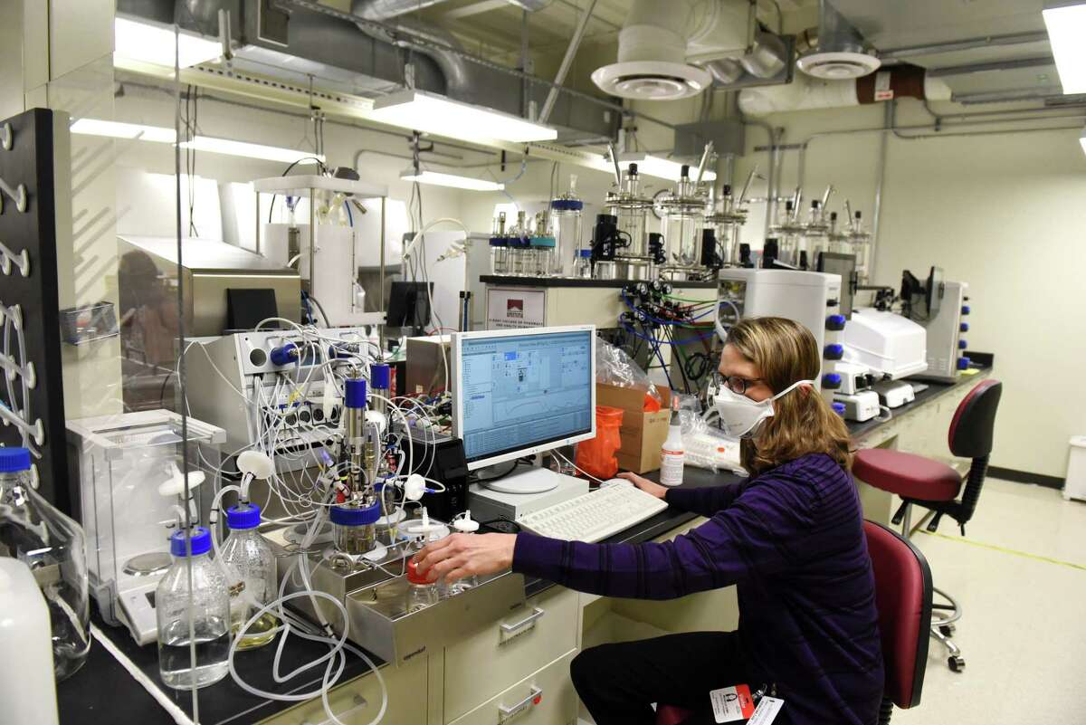 Michelle Lewis, executive director of the Stack Family Center for Biopharmaceutical Education and Training (CBET) works on equipment in the upstream production lab which produces biological material on Monday, Jan. 10, 2022, at NY CREATES in Albany, N.Y. The center opened in September and is aimed at fostering and developing the pharma workforce.