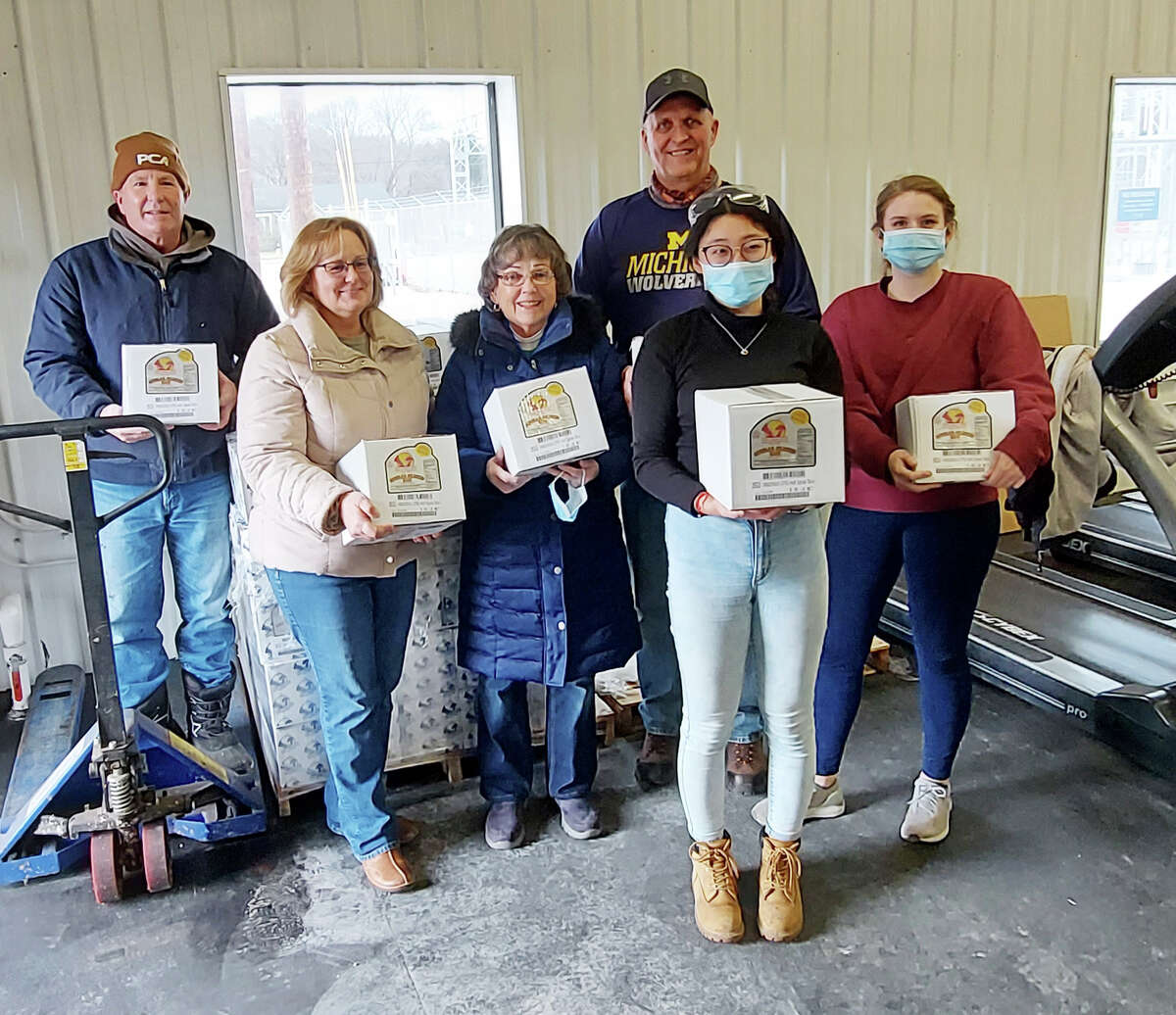 In December, PCA donated more than 100 hams to the  Matthew 25:35 Food Pantry. Pictured (front row, left to right) are Michelle Grassa, Joan Gamache, from Matthew 25:35 Food Pantry; Packaging Corporation of America employees: Angela Wang, environmental engineer; Christine Rogers, system analyst; (back row) Rod Gamache, power house oiler; Dave Cameron, union chief steward, of Steel Workers Union 12585.