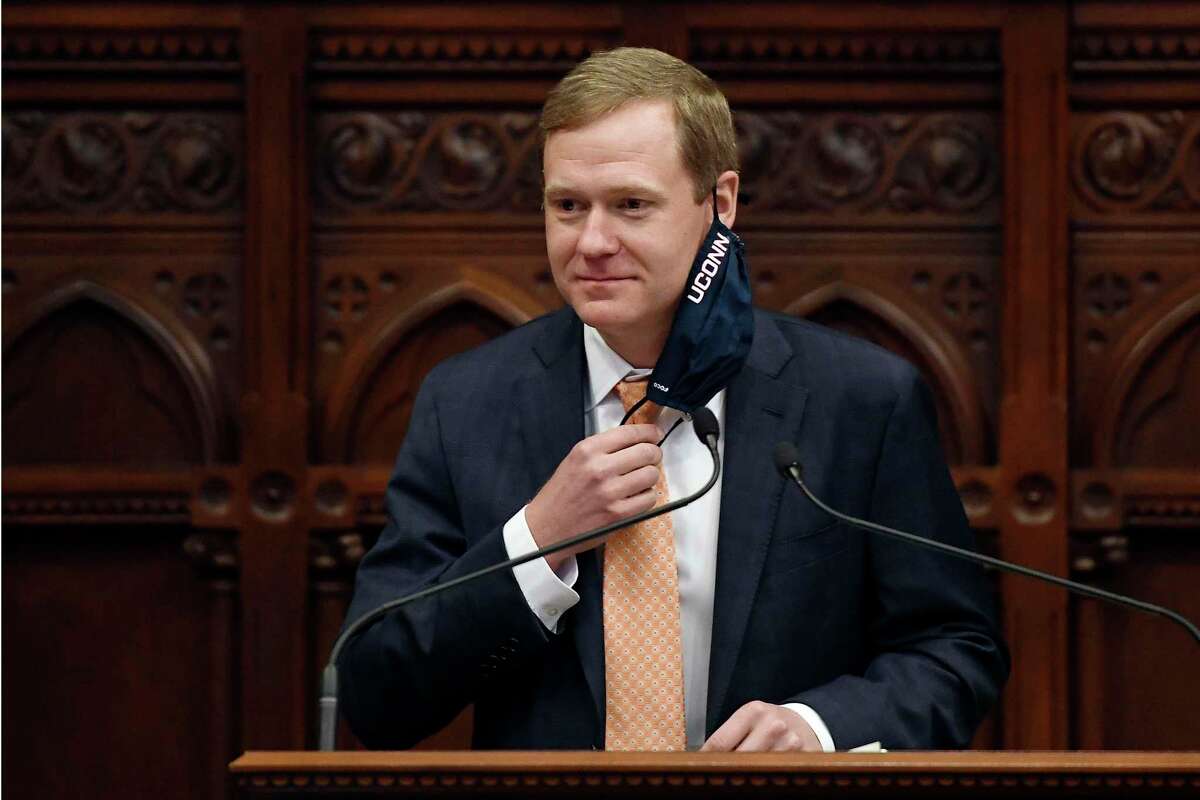 Connecticut Speaker of the House Matt Ritter, D-Hartford, pulls up his mask during session at the State Capitol, Monday, April 19, 2021. The Connecticut House of Representatives on Monday was expected to pass a contentious bill that would end the state's long-standing religious exemption from immunization requirements for schools. (AP Photo/Jessica Hill)