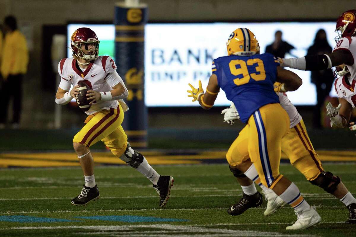 Southern California quarterback Jaxson Dart (2) rolls out to his right against California during the first quarter of an NCAA college football game, Saturday, Dec. 4, 2021, in Berkeley, Calif. (AP Photo/D. Ross Cameron)