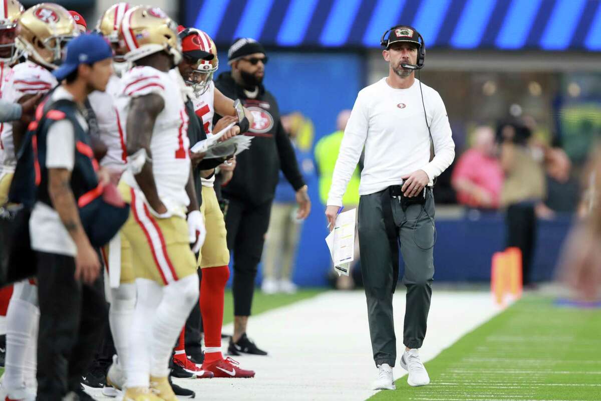 INGLEWOOD, CALIFORNIA - JANUARY 09: Head coach Kyle Shanahan of the San Francisco 49ers looks on from the sideline in the third quarter against the Los Angeles Rams at SoFi Stadium on January 09, 2022 in Inglewood, California. (Photo by Joe Scarnici/Getty Images)