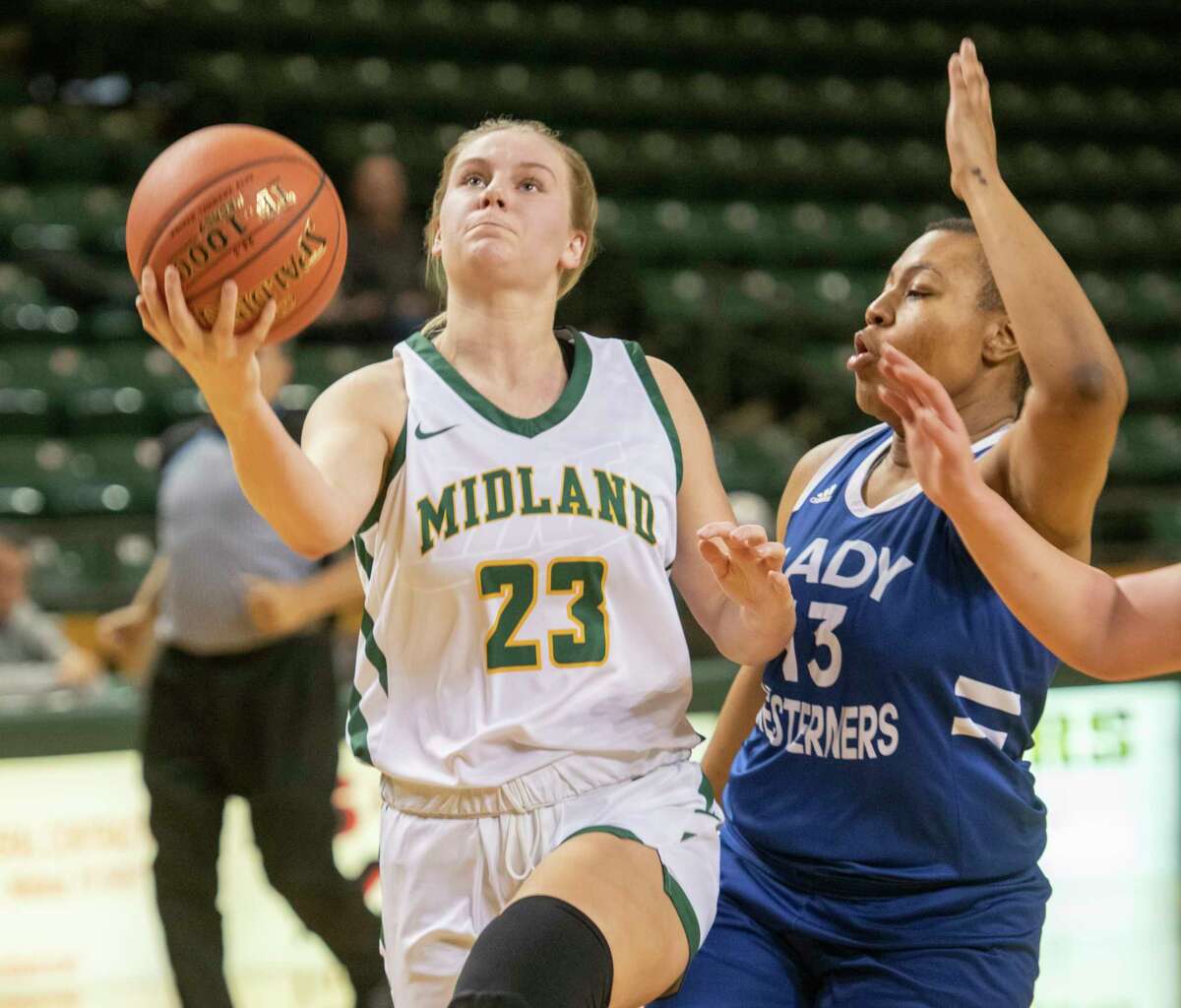 Midland College's Bella Green drives to the basket as Western Texas College's Maya Crimes defends 01/10/2022 at the Chaparral Center. Tim Fischer/Reporter-Telegram