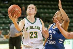 Midland College's Bella Green drives to the basket as Western Texas College's Maya Crimes defends 01/10/2022 at the Chaparral Center. Tim Fischer/Reporter-Telegram