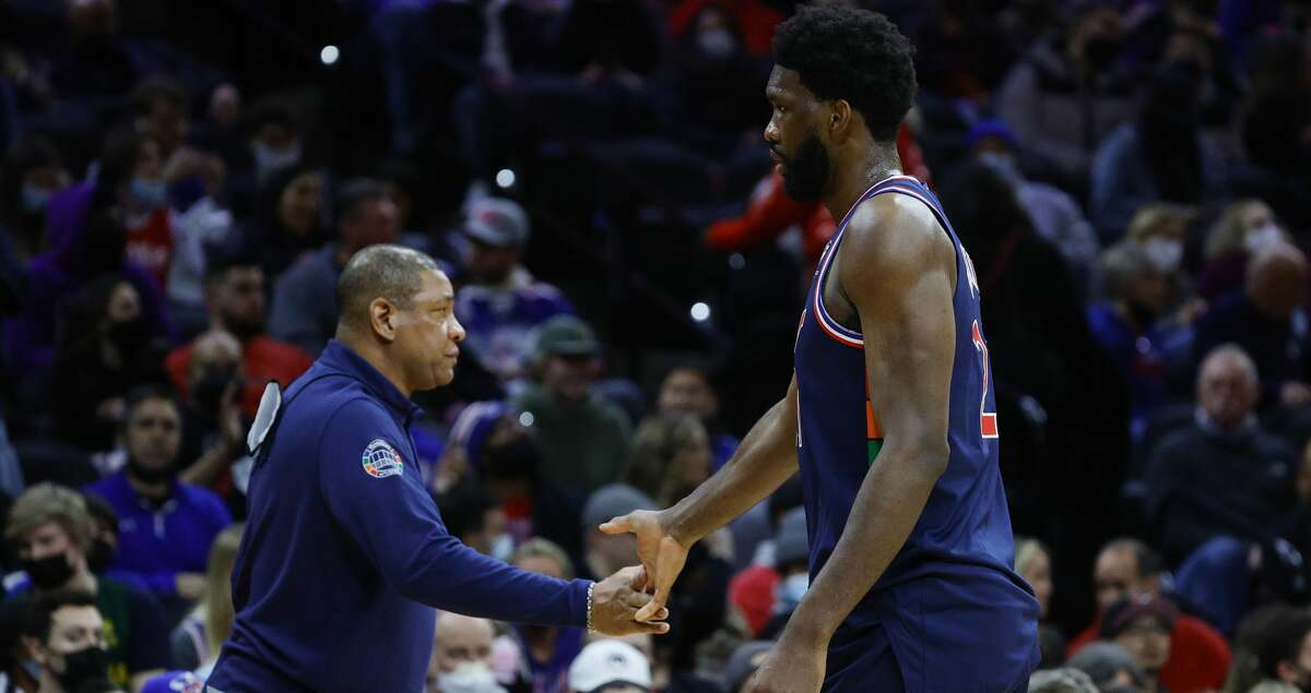 Head coach Doc Rivers and Joel Embiid #21 of the Philadelphia 76ers high five during the fourth quarter against the San Antonio Spurs at Wells Fargo Center on January 07, 2022 in Philadelphia, Pennsylvania. (Photo by Tim Nwachukwu/Getty Images)