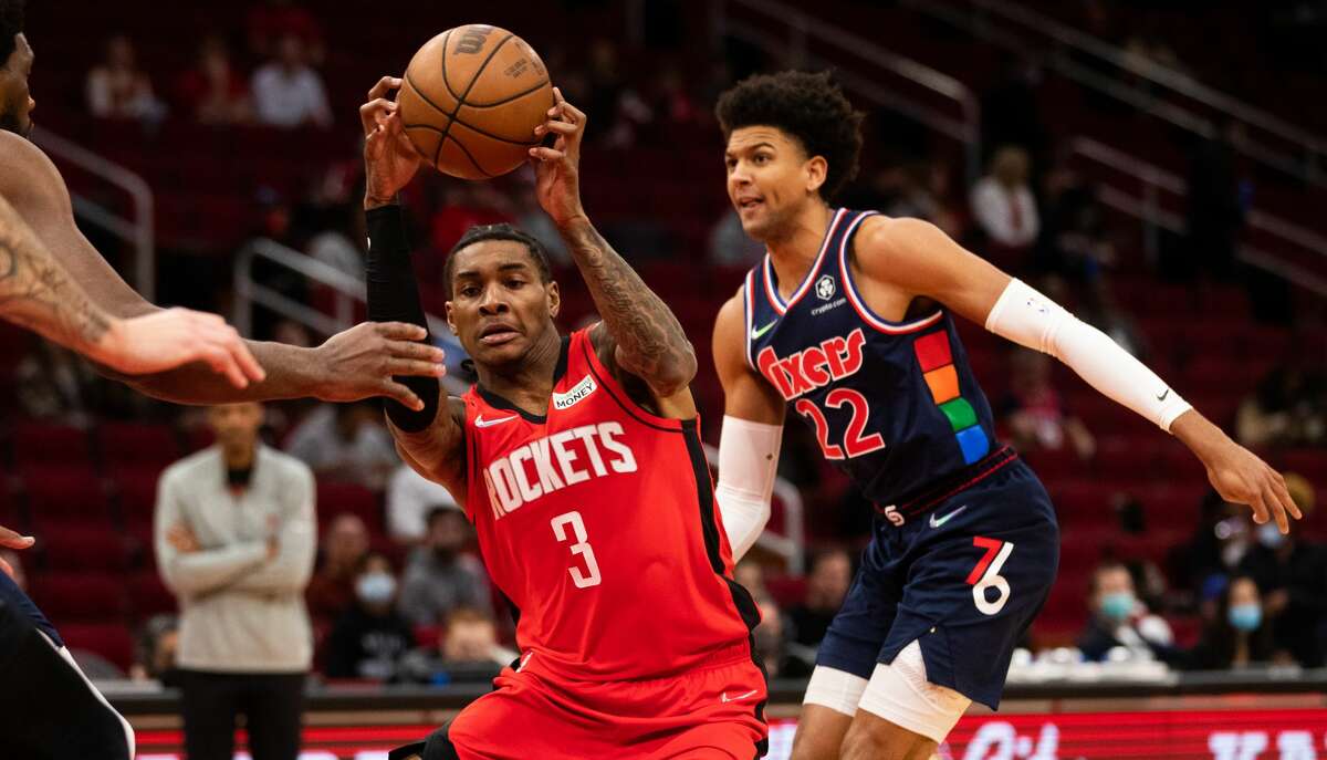 Houston Rockets guard Kevin Porter Jr. (3) tries to keep control of the ball under the pressure of Philadelphia 76ers guard Matisse Thybulle (22) during the first quarter of the game at the Toyota Center, Monday, Jan. 10, 2022, in Houston.