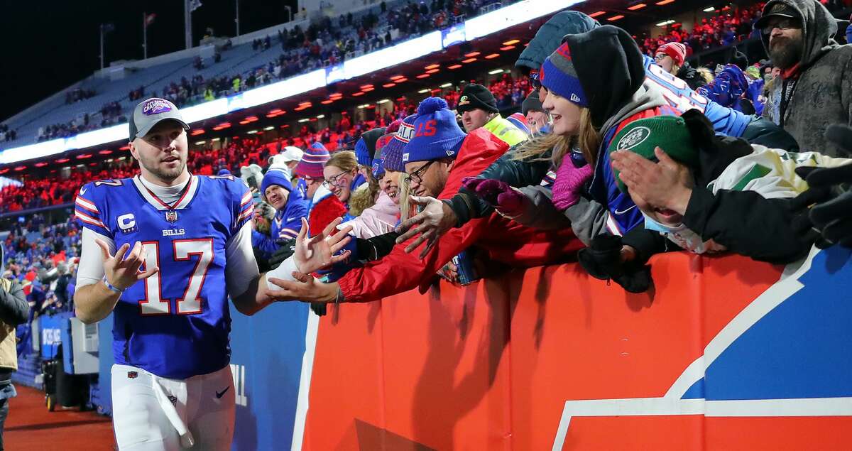 Josh Allen (17) of the Buffalo Bills celebrates with fans after defeating the New York Jets at Highmark Stadium on January 09, 2022, in Orchard Park, New York. (Timothy T Ludwig/Getty Images/TNS)