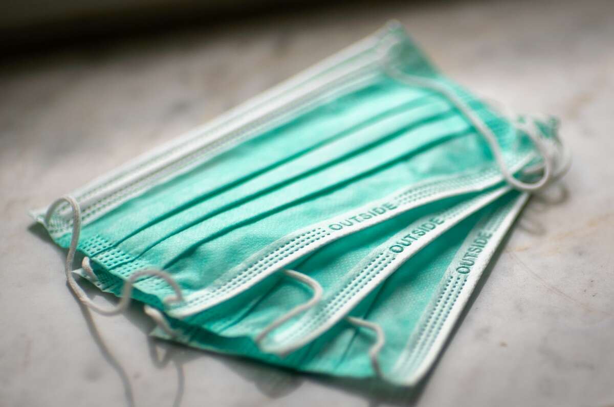 FILE - A photo of surgical masks worn to protect against COVID-19. 