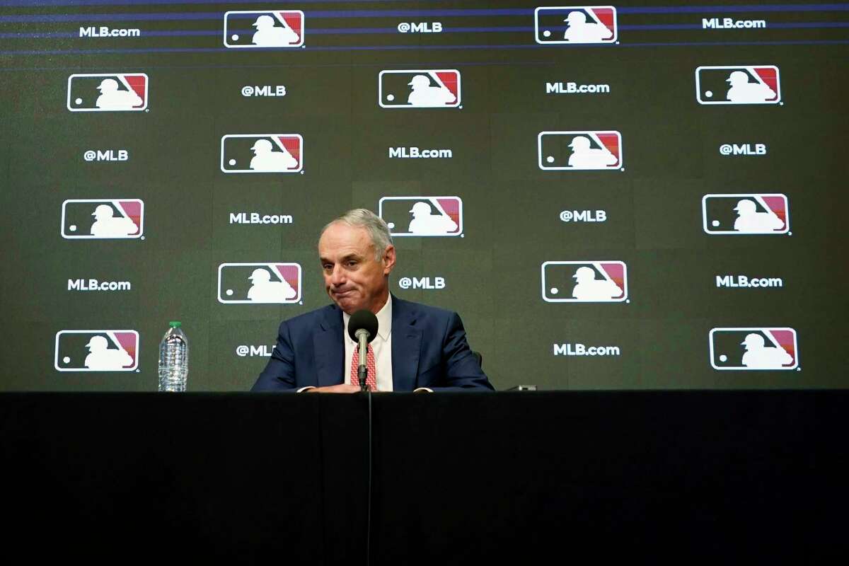 Major League Baseball commissioner Rob Manfred pauses during a news conference in Arlington, Texas, Thursday, Dec. 2, 2021. Owners locked out players at 12:01 a.m. Thursday following the expiration of the sport's five-year collective bargaining agreement.