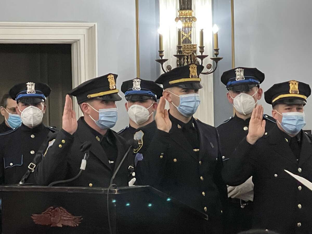 Schenectady police recruits, as well as officers who received promotions, were ceremonially sworn in at City Hall on Jan. 10, 2022.