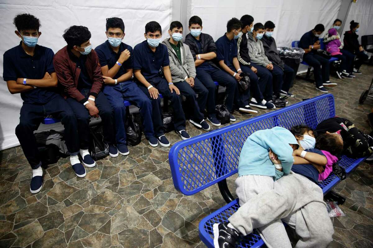 DONNA, TEXAS - MARCH 30: Young unaccompanied migrants, wait for their turn at the secondary processing station in the Department of Homeland Security holding facility on March 30, 2021 in Donna, Texas. The Donna location is the main detention center for unaccompanied children coming across the U.S. border in the Rio Grande Valley.