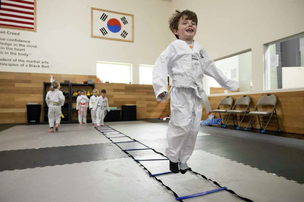 Loxley Palacios warms-up before practicing taekwondo at The Way Family Dojo, Wednesday, Jan. 20, 2021, in Magnolia. The Way Family Dojo will host its third annual Health & Wellness Expo on Jan. 22.