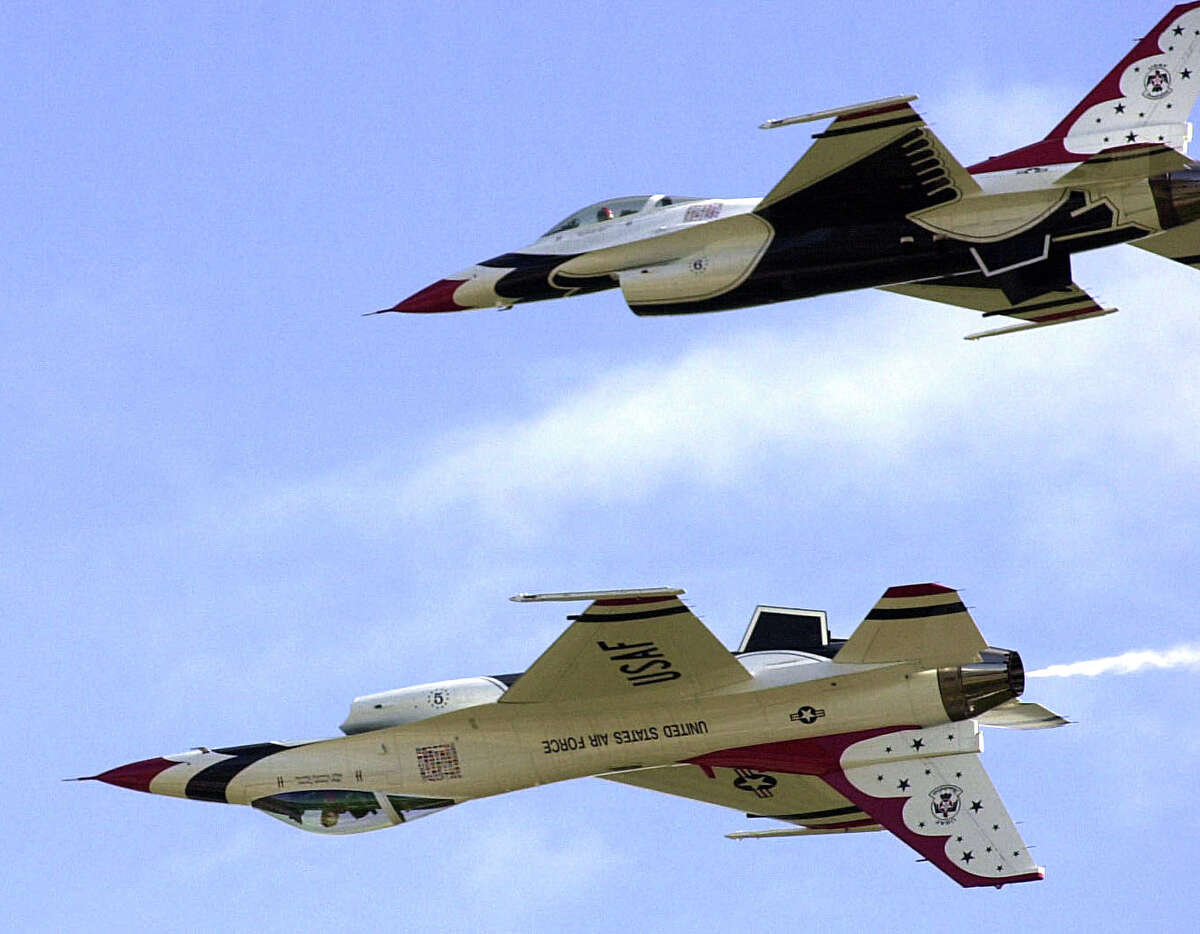 Maj. Scottie Zamzow, bottom, and Maj. Brian Farrar perform a maneuver Saturday, Oct. 29, 2005 at the air base of Ilopango in San Salvador, El Salvador during a program by the U.S. Air Force Air Demonstration Squadron, "Thunderbirds." The Squadron will be in San Antonio in April for the Great Texas Airshow. 